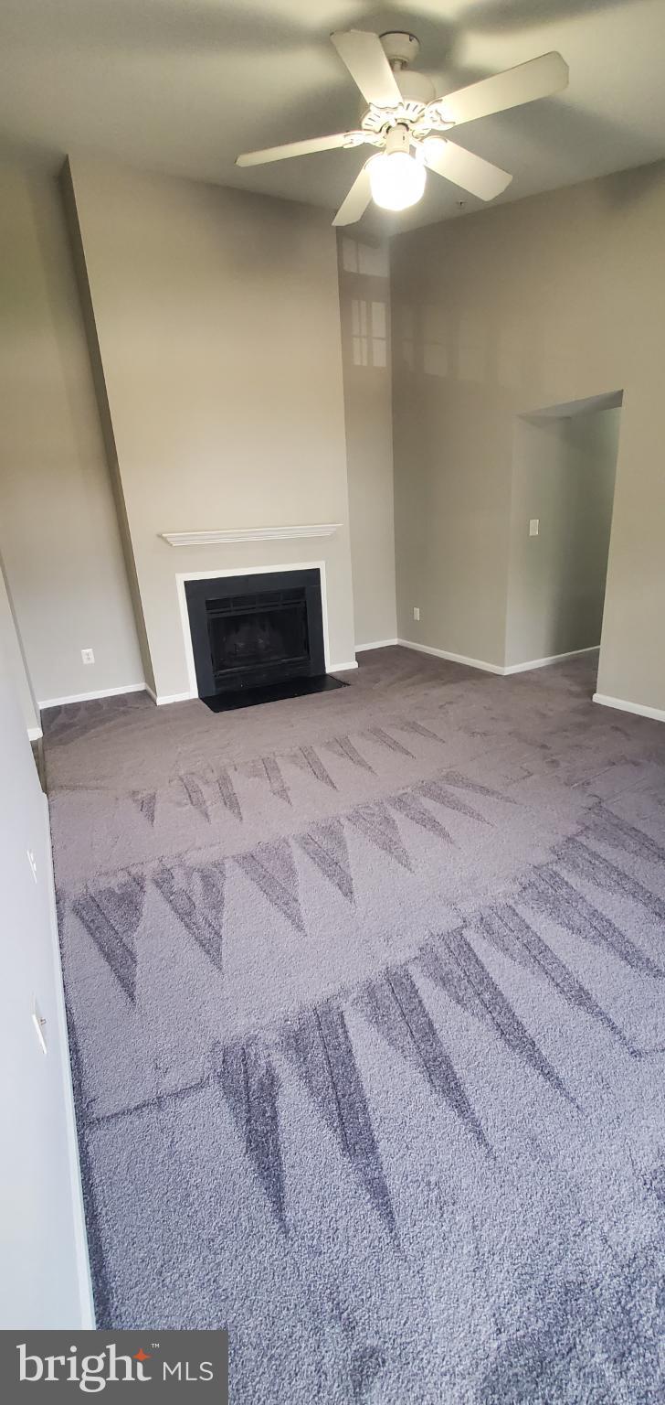 8343 Montgomery Run Road Ellicott City, MD 21043 - Photo 17 of 27 Spacious living area with cozy fireplace.