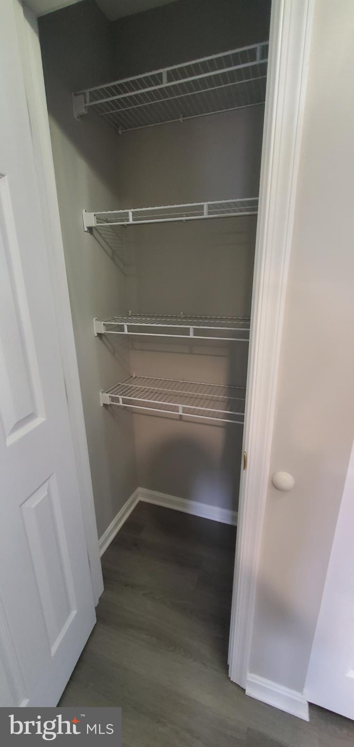 8343 Montgomery Run Road Ellicott City, MD 21043 - Photo 20 of 27 Spacious closet with versatile shelving.