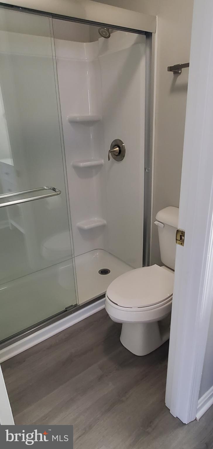 8343 Montgomery Run Road Ellicott City, MD 21043 - Photo 6 of 27 Modern bathroom with sleek glass shower.