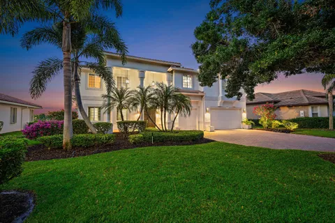 a view of an house with backyard space and garden