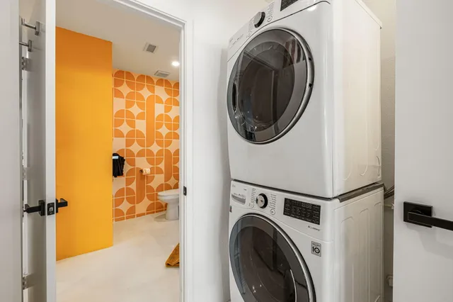 a view of a hallway with washer and dryer