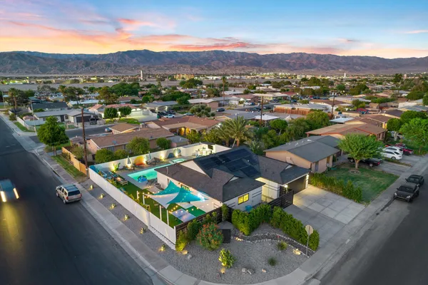 an aerial view of residential houses and outdoor space