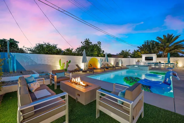 a view of an outdoor sitting area with furniture