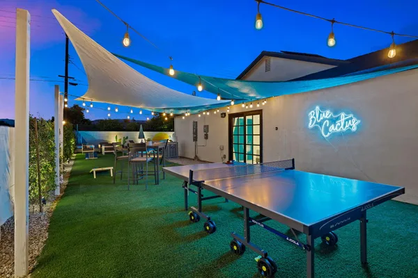 a room with lots of table and chairs