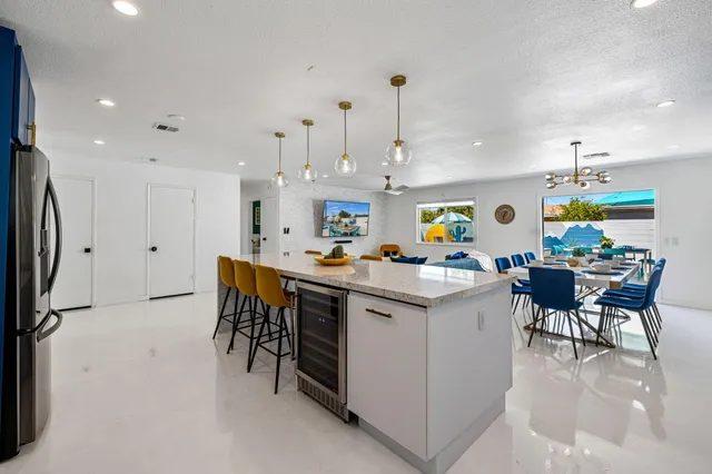 a kitchen that has a lot of cabinets in it and appliances
