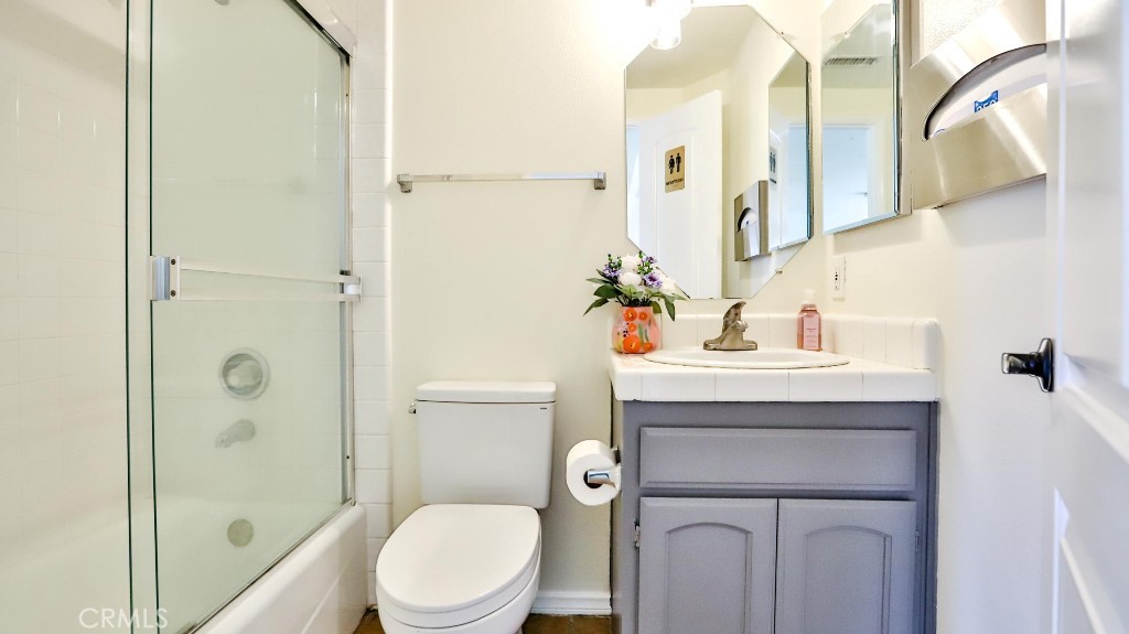 7855 Westpark Drive Riverside, CA 92506 - Photo 20 of 49 a bathroom with a sink toilet and shower