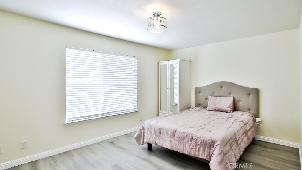 7855 Westpark Drive Riverside, CA 92506 - Photo 21 of 49 a bedroom with a bed and a window