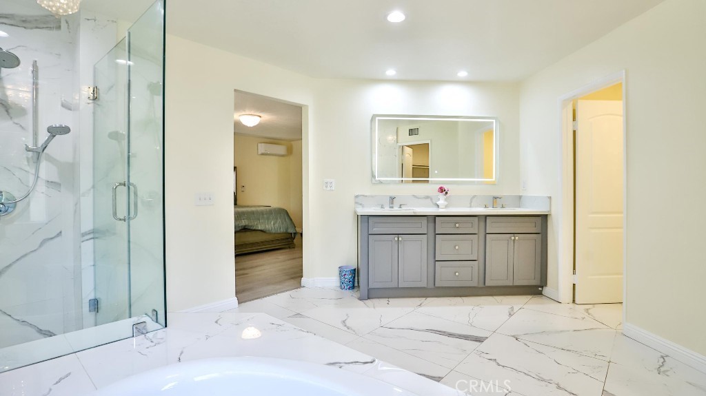 7855 Westpark Drive Riverside, CA 92506 - Photo 28 of 49 a bathroom with a sink and a mirror