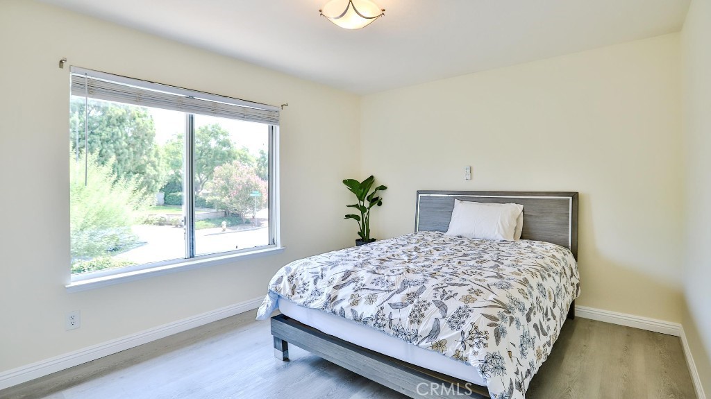 7855 Westpark Drive Riverside, CA 92506 - Photo 33 of 49 a bedroom with a bed and window