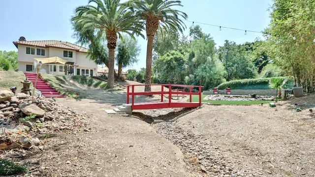 an aerial view of a house with yard