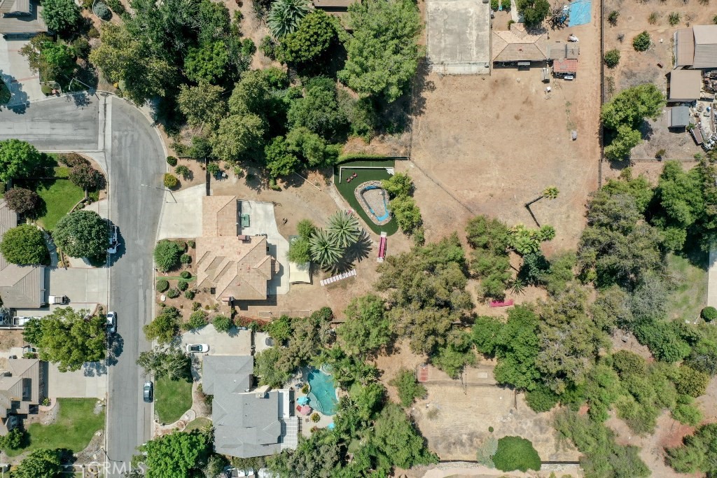 7855 Westpark Drive Riverside, CA 92506 - Photo 43 of 49 an aerial view of a house with a yard and garden