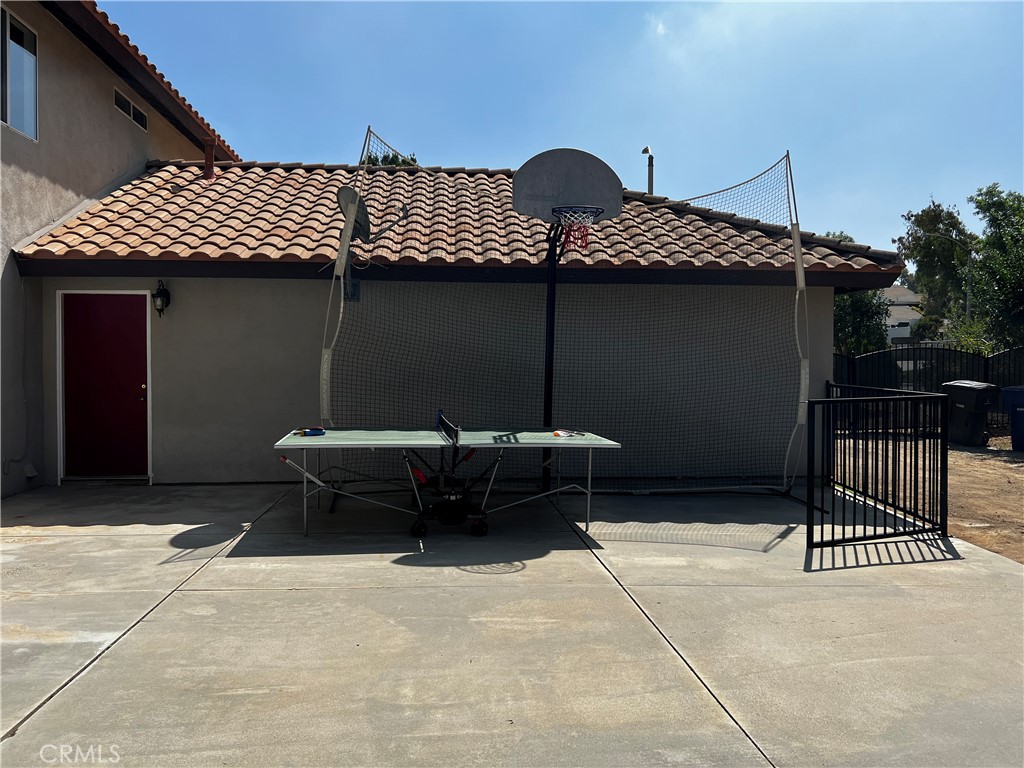 7855 Westpark Drive Riverside, CA 92506 - Photo 46 of 49 a backyard of a house with table and chairs