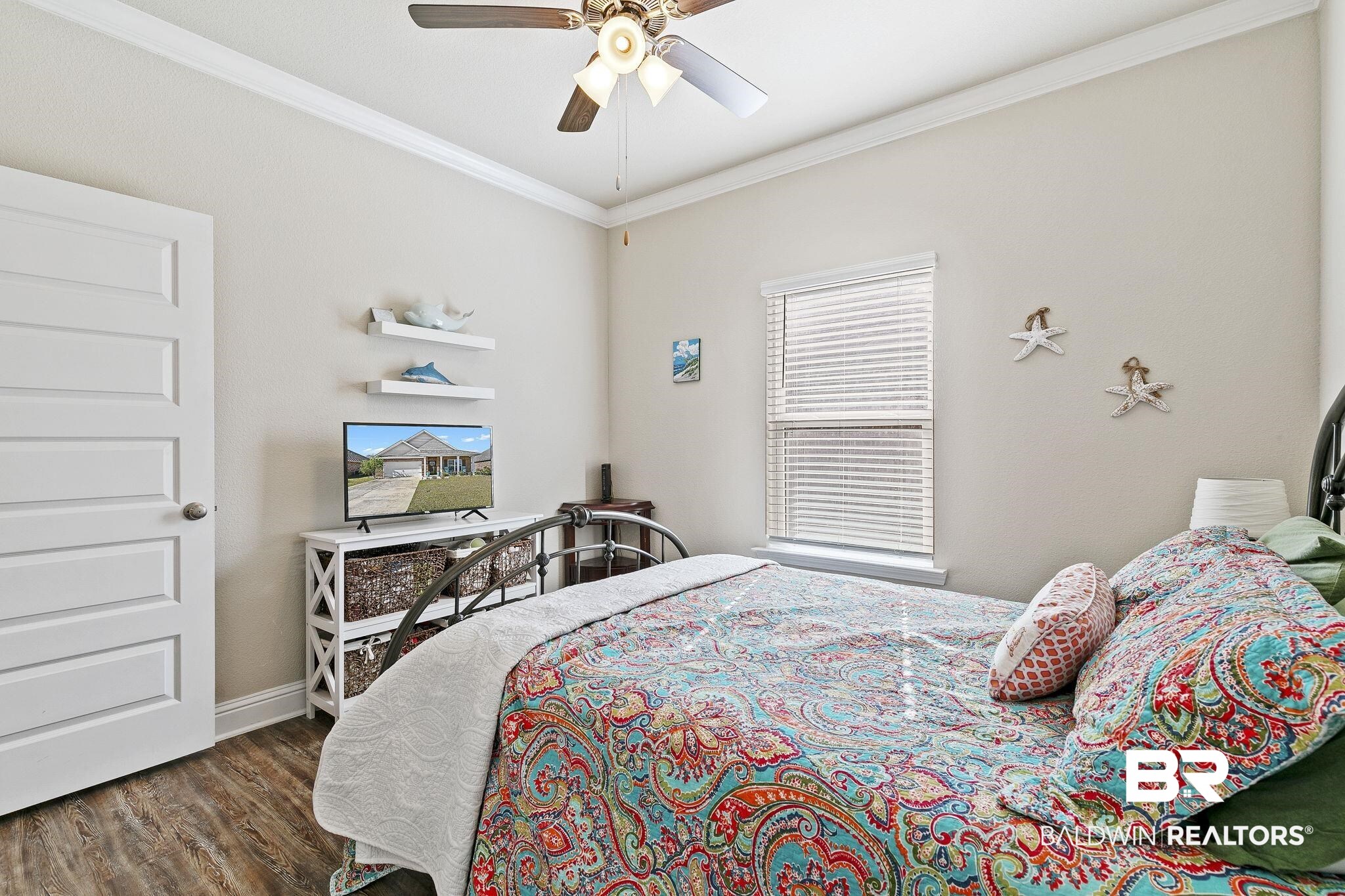 1319 Kairos Loop Foley, AL 36535 - Photo 31 of 64 Bedroom featuring ceiling fan, dark hardwood / wood-style floors, and ornamental molding