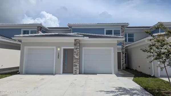 a view of a house with a garage