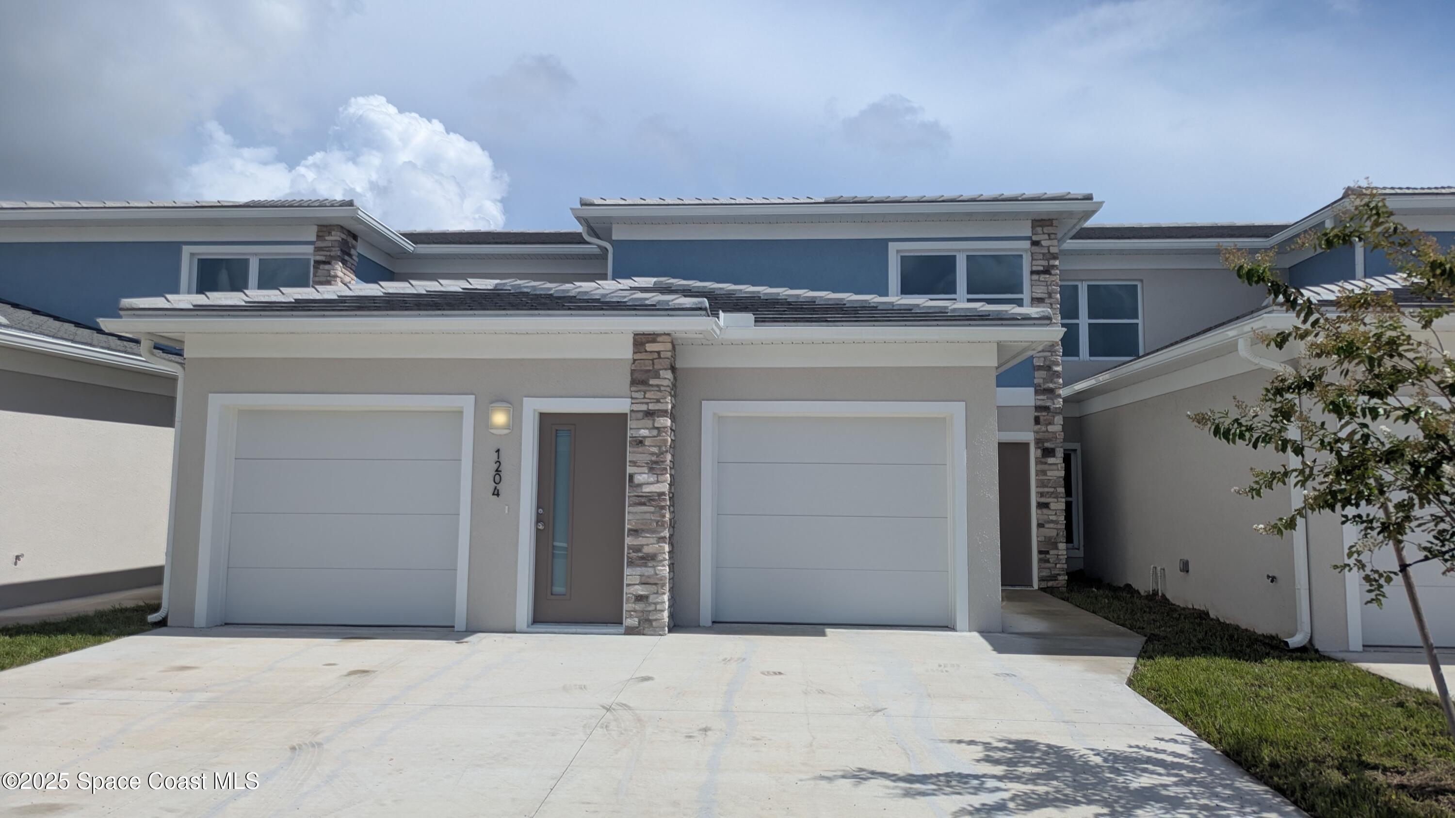 a view of a house with a garage