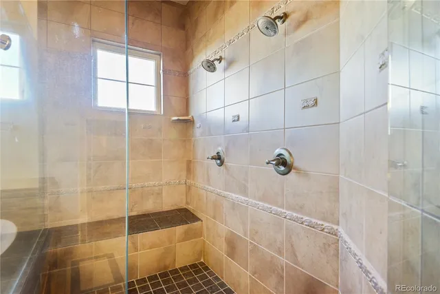 a bathroom with a glass door shower