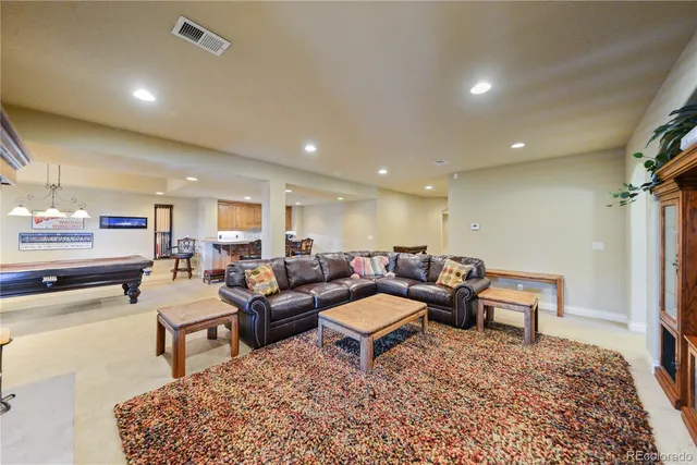 a living room with furniture and a rug