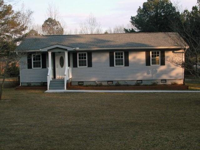 409 North Old Alabama Road Thomaston, GA 30286 - Photo 1 of 1 a front view of a house with a garden