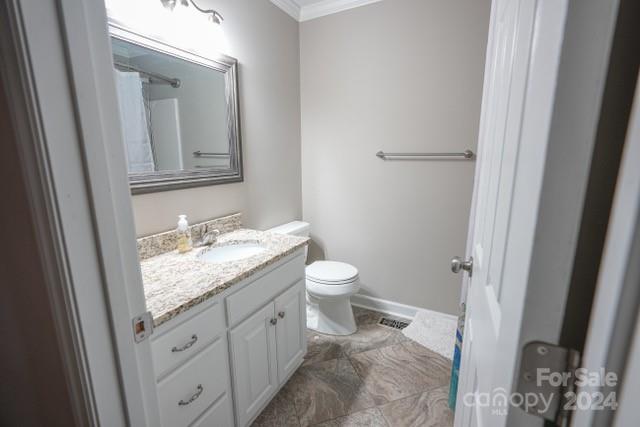 957 State Rd S-29-38 Lancaster, SC 29720 - Photo 13 of 25 a bathroom with a granite countertop toilet a sink and a mirror