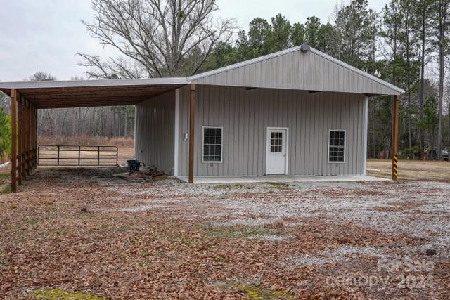 957 State Rd S-29-38 Lancaster, SC 29720 - Photo 22 of 25 a house with trees in the background