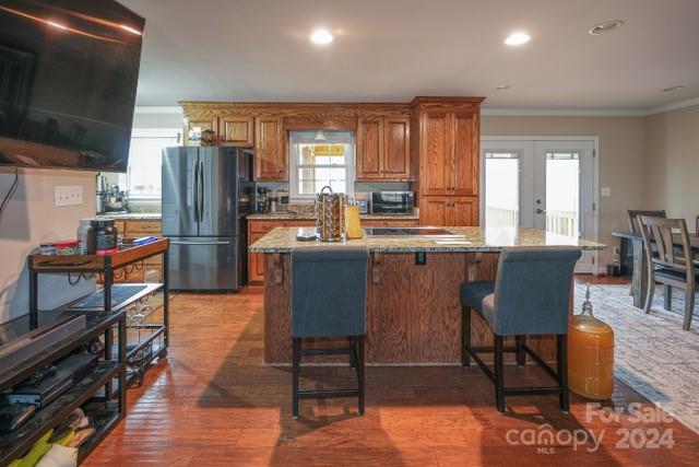 957 State Rd S-29-38 Lancaster, SC 29720 - Photo 7 of 25 a kitchen with stainless steel appliances granite countertop a table chairs refrigerator a sink dishwasher and a stove with wooden floor