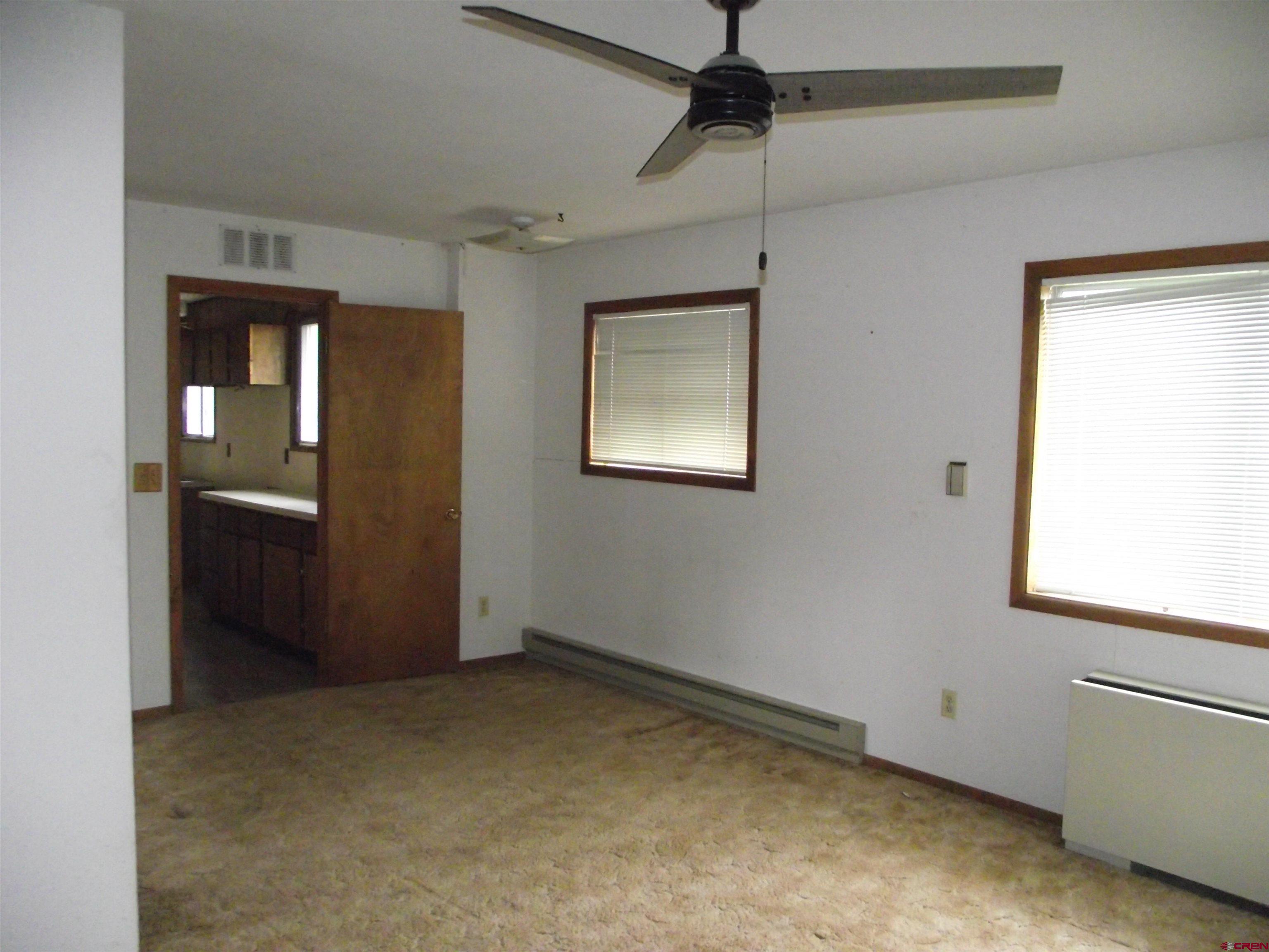 42996 Needle Rock Road Crawford, CO 81415 - Photo 27 of 45 an empty room with windows and closet
