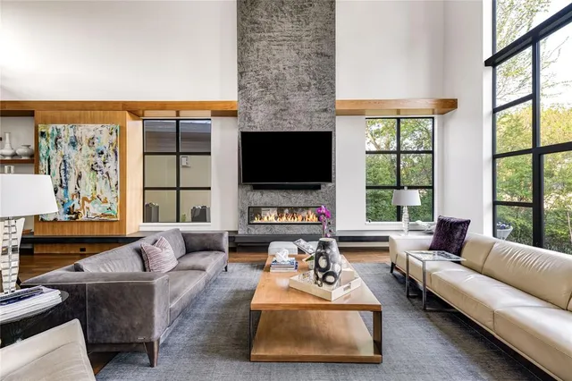 a living room with furniture fireplace and a flat screen tv