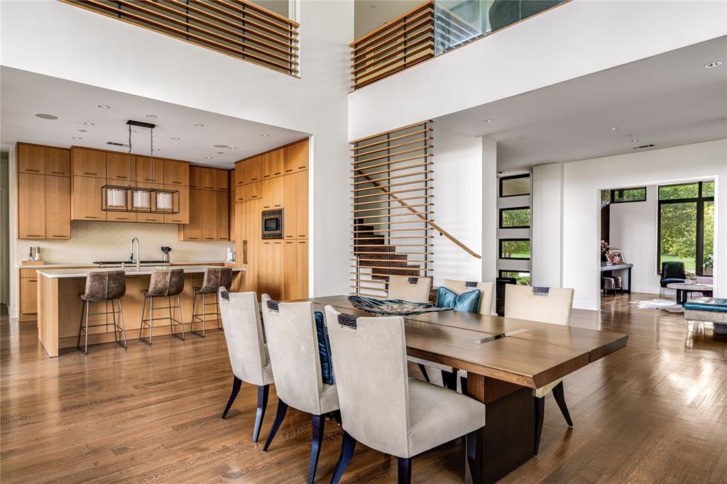 11460 Strait Lane Dallas, TX 75229 - Photo 13 of 39 a view of a dining room with furniture and wooden floor