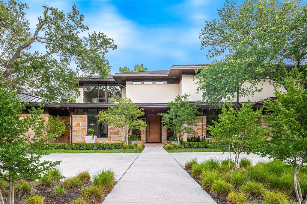 11460 Strait Lane Dallas, TX 75229 - Photo 2 of 39 a front view of a house with garden