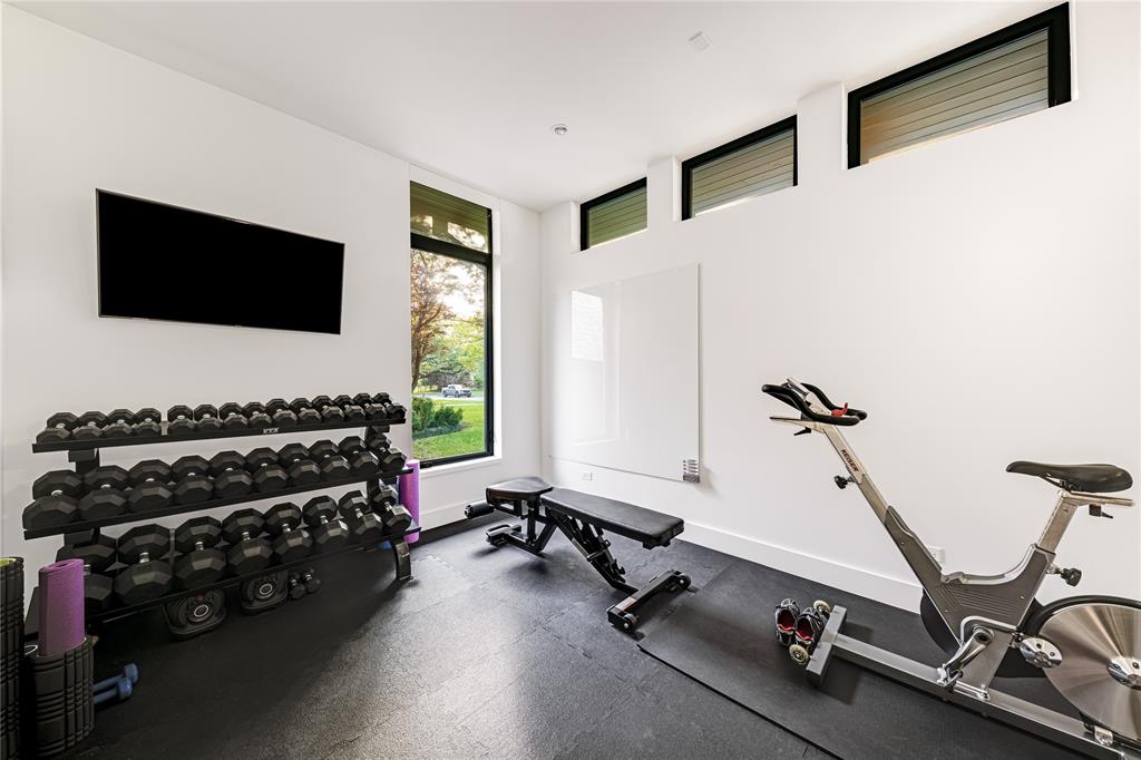 11460 Strait Lane Dallas, TX 75229 - Photo 30 of 39 a view of a room with gym equipment