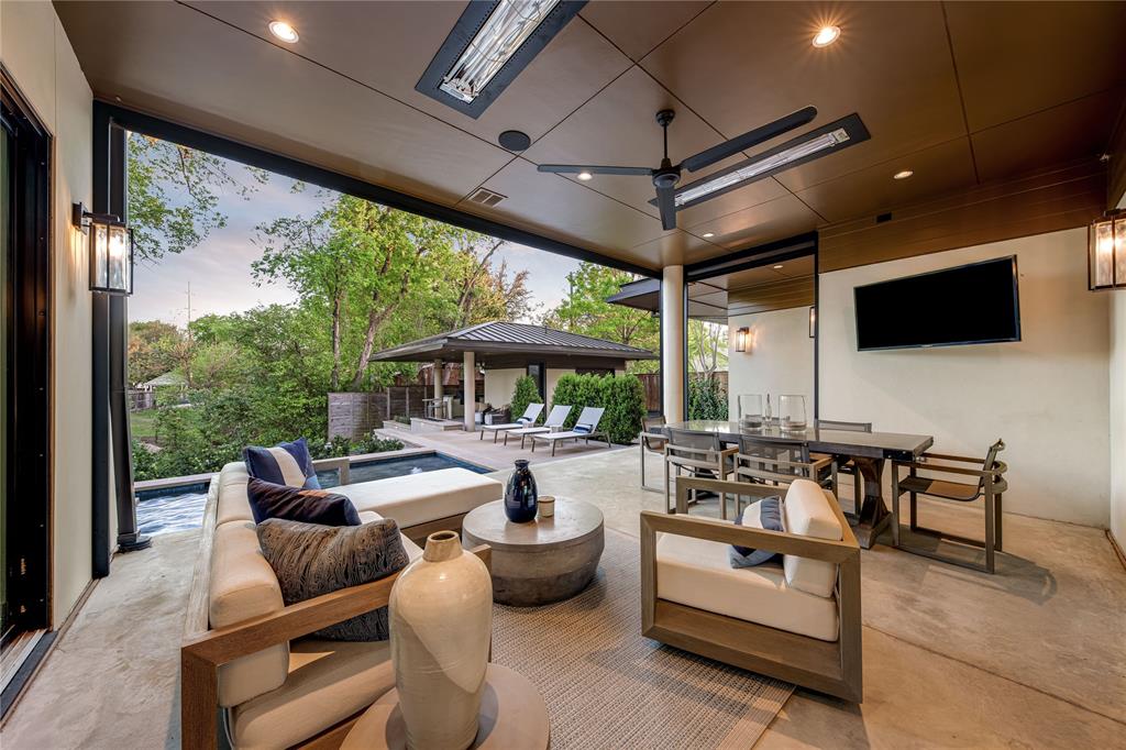 11460 Strait Lane Dallas, TX 75229 - Photo 31 of 39 a outdoor space with patio furniture and a fireplace