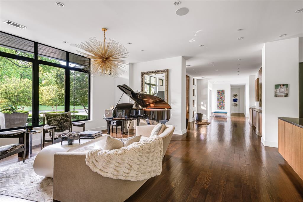 11460 Strait Lane Dallas, TX 75229 - Photo 9 of 39 a living room with furniture large window and wooden floor