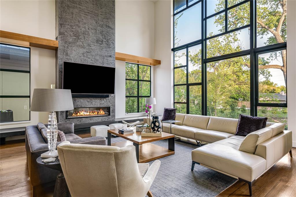 11460 Strait Lane Dallas, TX 75229 - Photo 10 of 39 a living room with furniture a large window and a flat screen tv