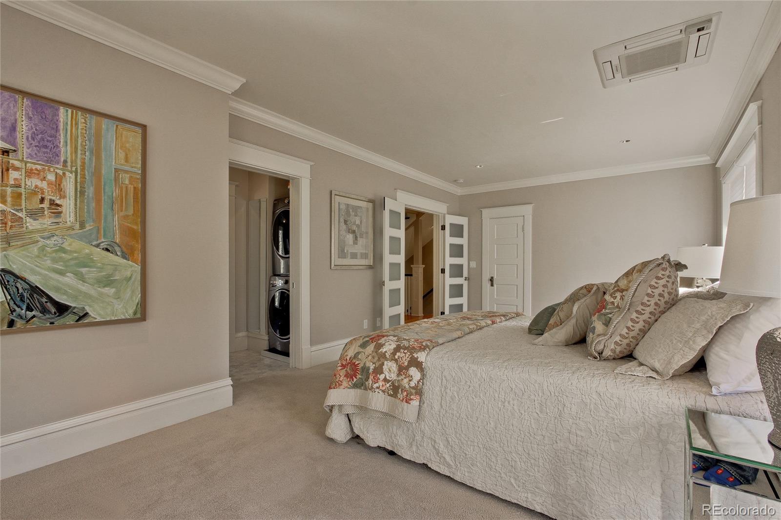 935 10th Street Boulder, CO 80302 - Photo 18 of 40 a bedroom with a bed and walk in closet