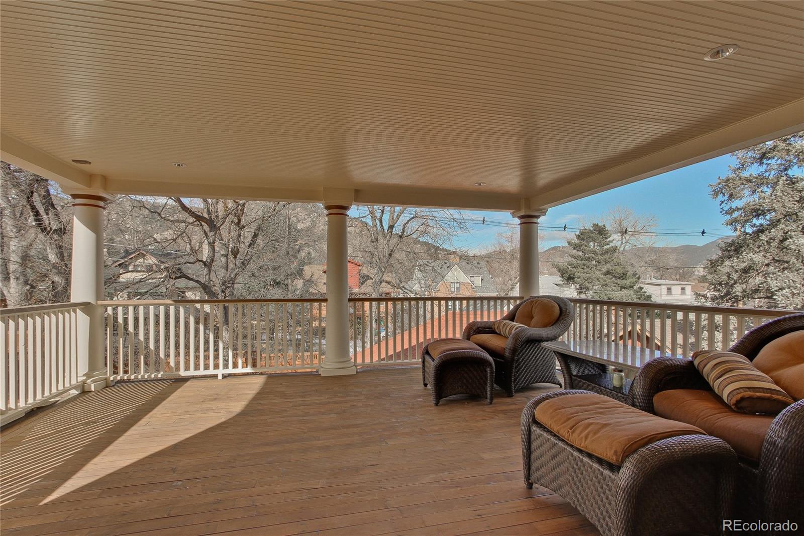 935 10th Street Boulder, CO 80302 - Photo 19 of 40 a view of a patio with couches chairs and wooden floor