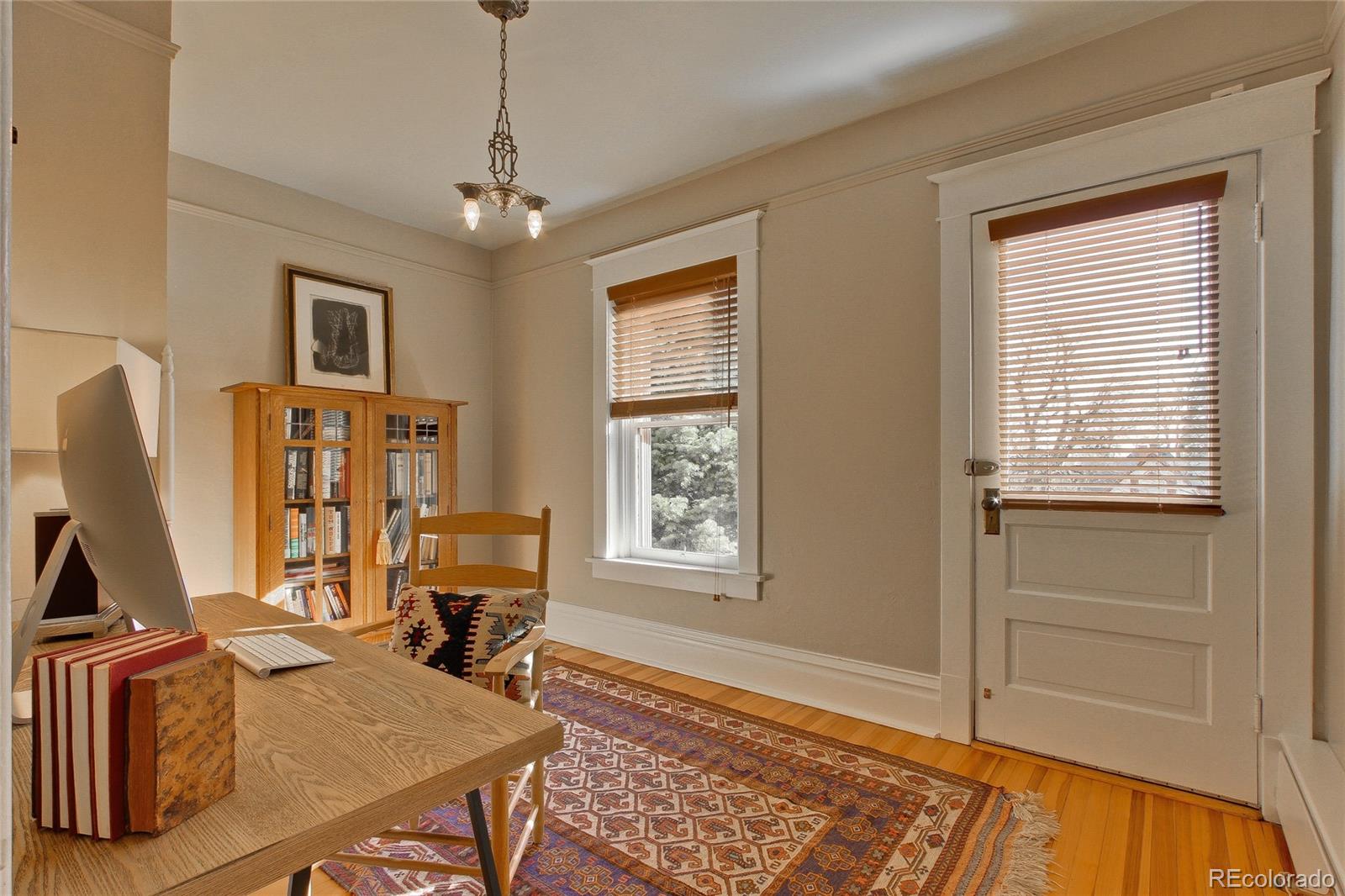935 10th Street Boulder, CO 80302 - Photo 23 of 40 a view of a workspace with furniture and a window