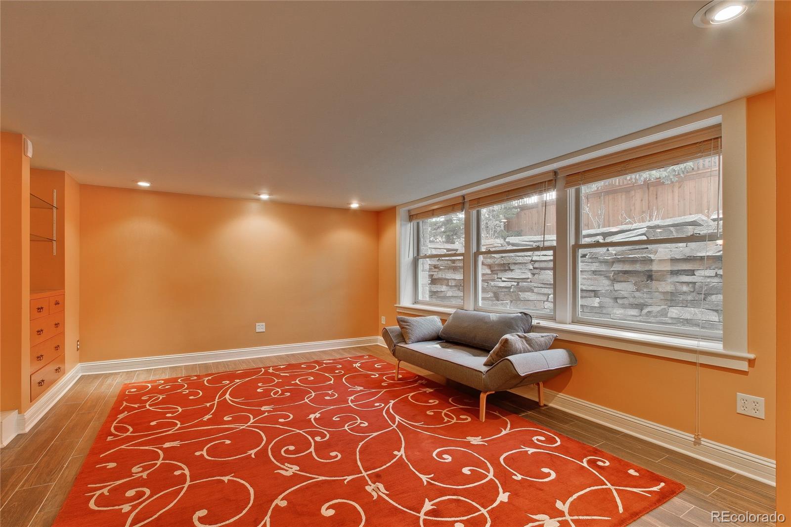 935 10th Street Boulder, CO 80302 - Photo 31 of 40 a living room with a couch and a rug