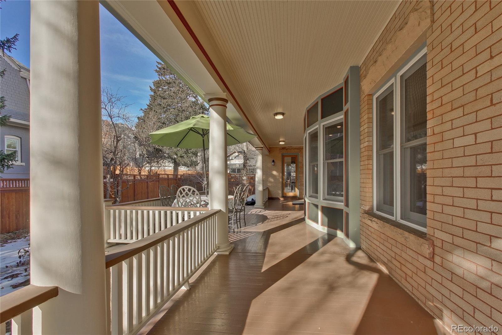 935 10th Street Boulder, CO 80302 - Photo 35 of 40 a view of a porch with wooden floor and floor to ceiling window