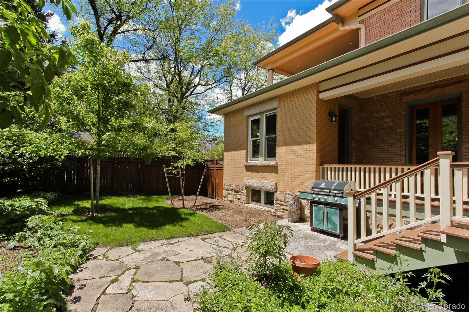 935 10th Street Boulder, CO 80302 - Photo 38 of 40 a front view of a house with a yard