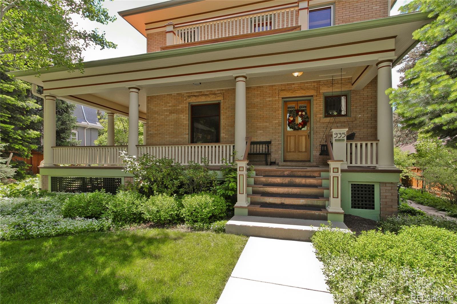 935 10th Street Boulder, CO 80302 - Photo 4 of 40 a front view of a house with a garden