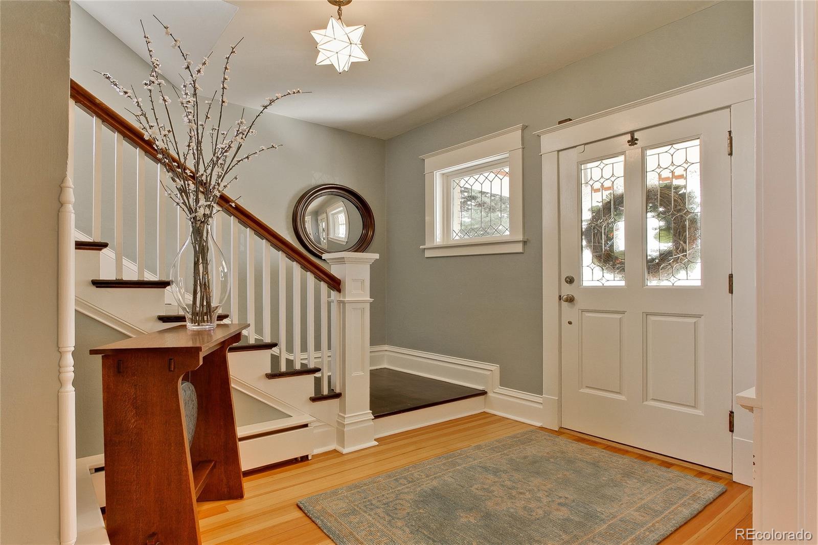 935 10th Street Boulder, CO 80302 - Photo 6 of 40 a view of a hallway with entryway wooden floor and front door