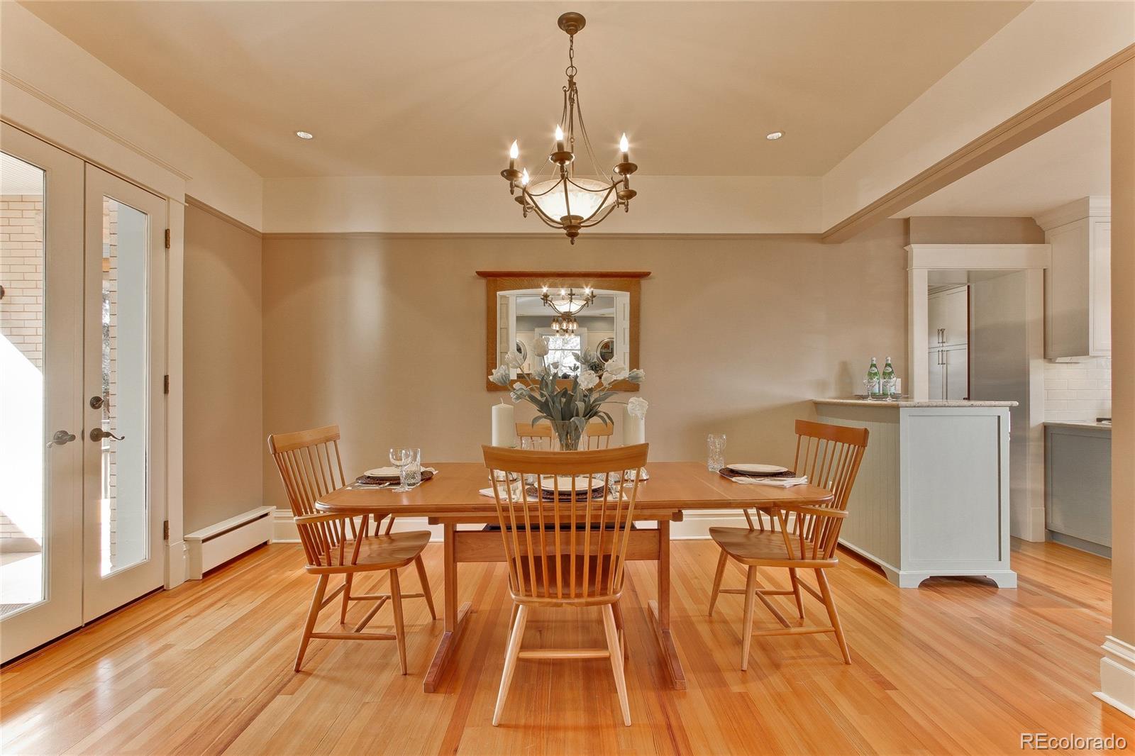 935 10th Street Boulder, CO 80302 - Photo 9 of 40 a view of a dining room with furniture wooden floor and a chandelier