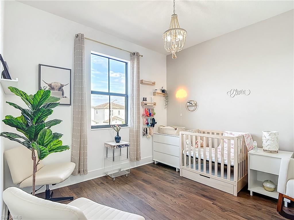 5502 Cassidy Lane Immokalee, FL 34142 - Photo 12 of 20 a living room with furniture and a chandelier
