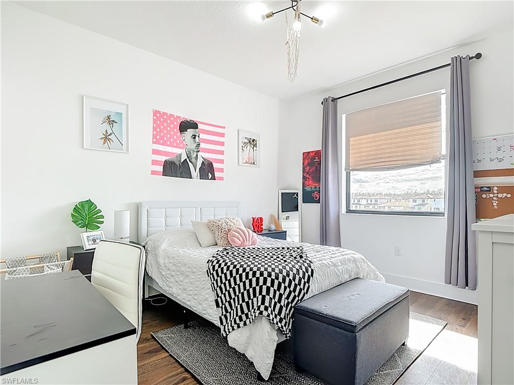 5502 Cassidy Lane Immokalee, FL 34142 - Photo 13 of 20 a bedroom with a bed and a table in it