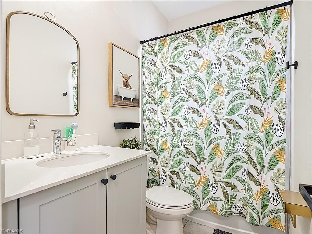 5502 Cassidy Lane Immokalee, FL 34142 - Photo 14 of 20 a bathroom with a sink and a mirror
