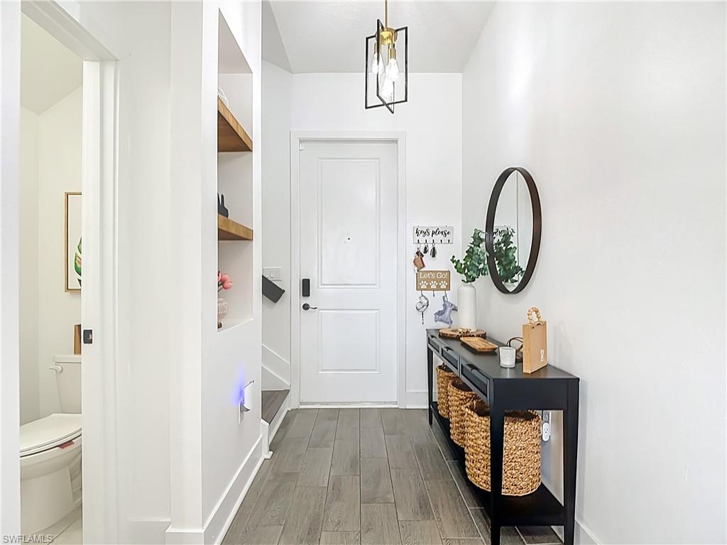 5502 Cassidy Lane Immokalee, FL 34142 - Photo 2 of 20 a view of a hallway to a livingroom and a front door