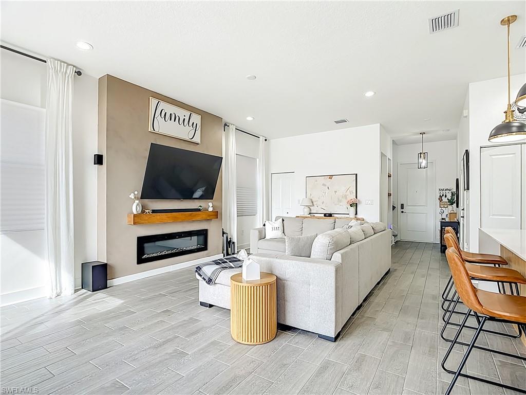 5502 Cassidy Lane Immokalee, FL 34142 - Photo 6 of 20 a living room with furniture and a flat screen tv