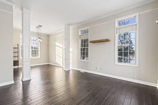 a bathroom with a granite countertop sink a toilet and mirror