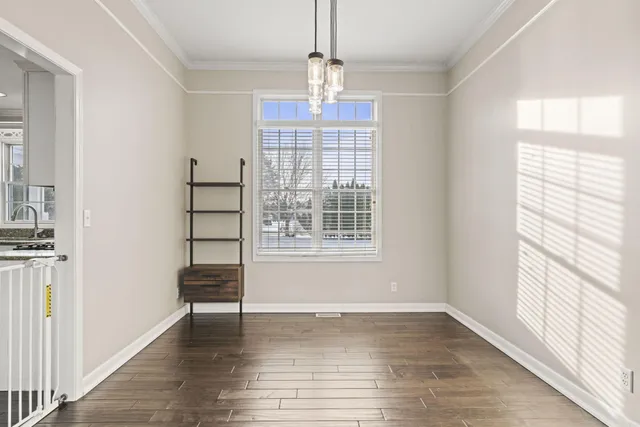 a bedroom with a bed and a chair