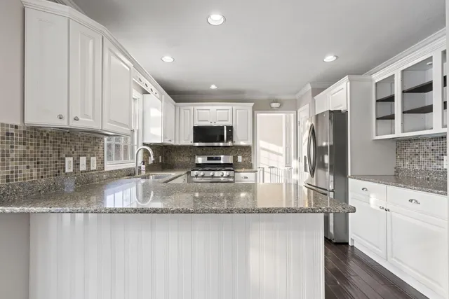 a bathroom with a sink double vanity and a bathtub